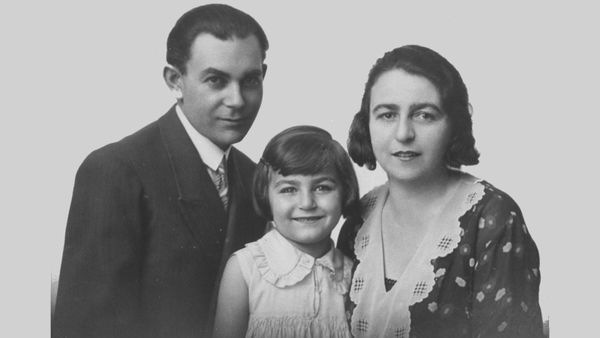 Happy family, child smiling at camera.