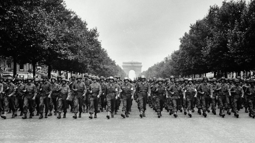 American soldiers marching in France during World War II. 