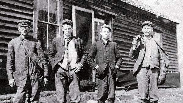 Males enjoying outdoors in timeless black and white.