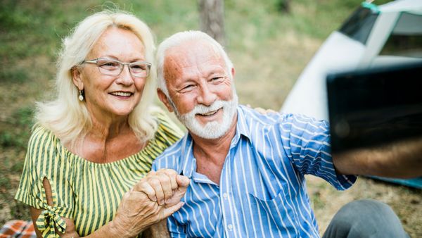 A senior couple taking a selfie. 