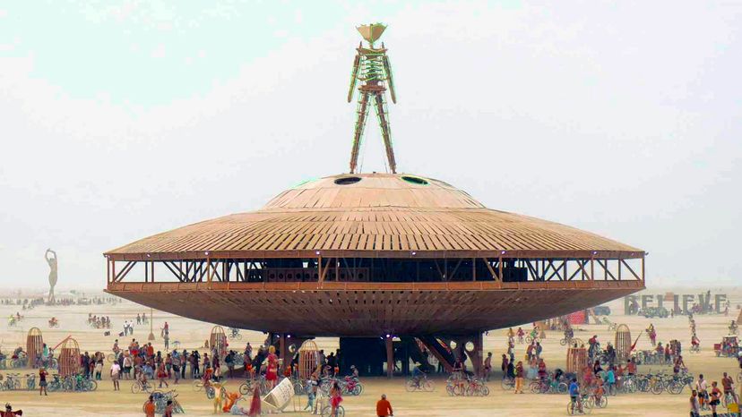 Burning man spaceship with alien on top