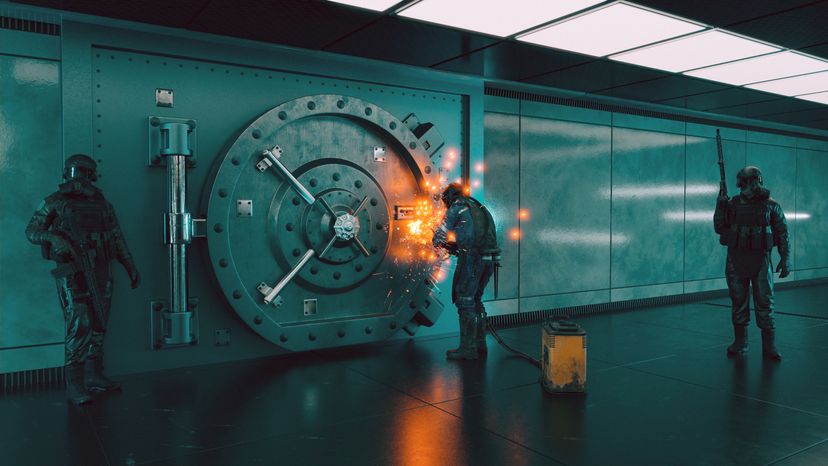 Bank robbers trying to break into a vault. 