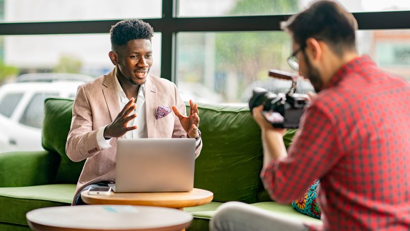 A vlogger with a cameraman 