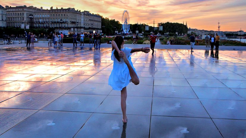 Young girl dances at Bordeaux's Water Mirror