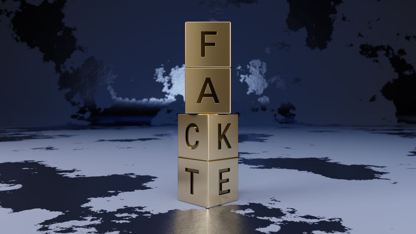 A stack of letter blocks spelling 'fact' and 'fake'.
