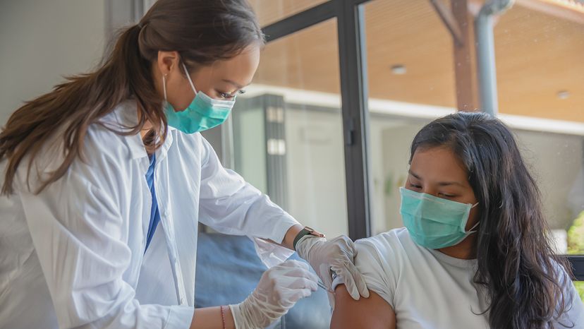 Woman receiving booster shot