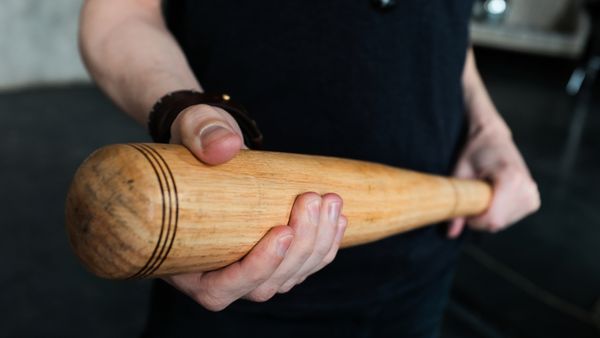 A man holding a baseball bat. 