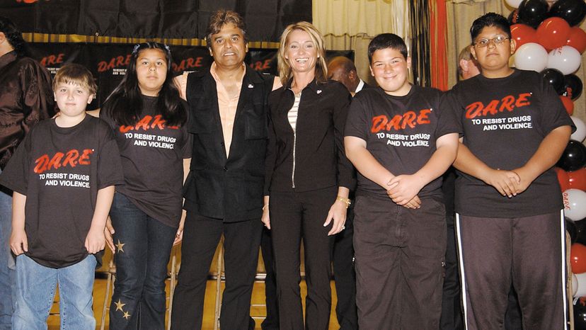 Actor Erik Estrada and former gymnast Nadia Comaneci (C) pose with D.A.R.E. students during a rally for the proclamation of National D.A.R.E. (Drug Abuse Resistance Education) Day April 11, 2002 in North Hollywood, California.  Robert Mora/Getty Images
