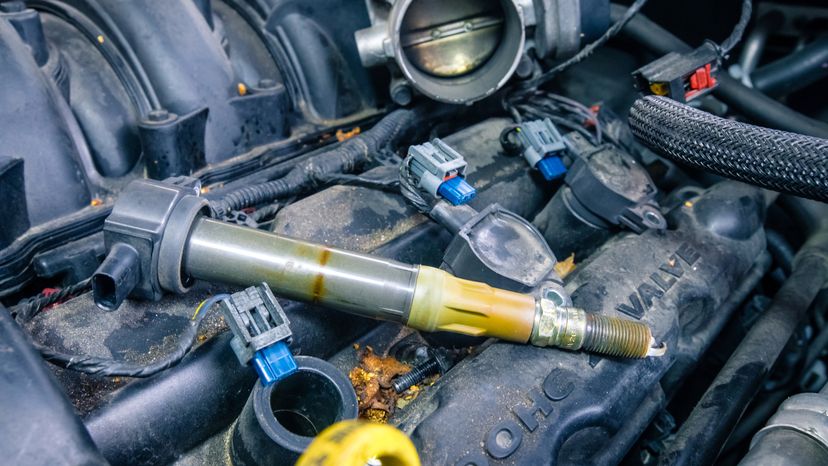 Distributor caps pass the voltage from the ignition coils to the engine's cylinders to ignite the fuel-air mixture and power the engine. Jorge Villalba / Getty Images
