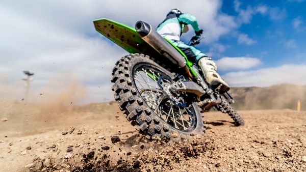 A close up image of a motorcycle wheels. 