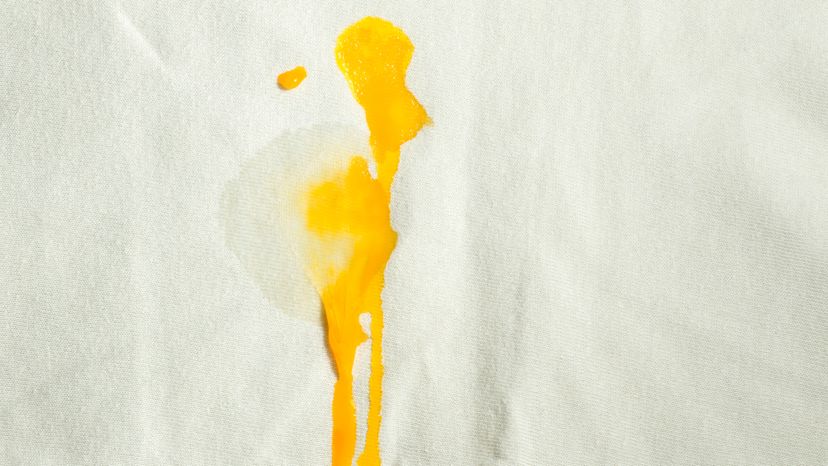 Egg yolk stain on a white shirt, 