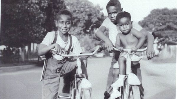 Smiling boys outdoors in childhood.