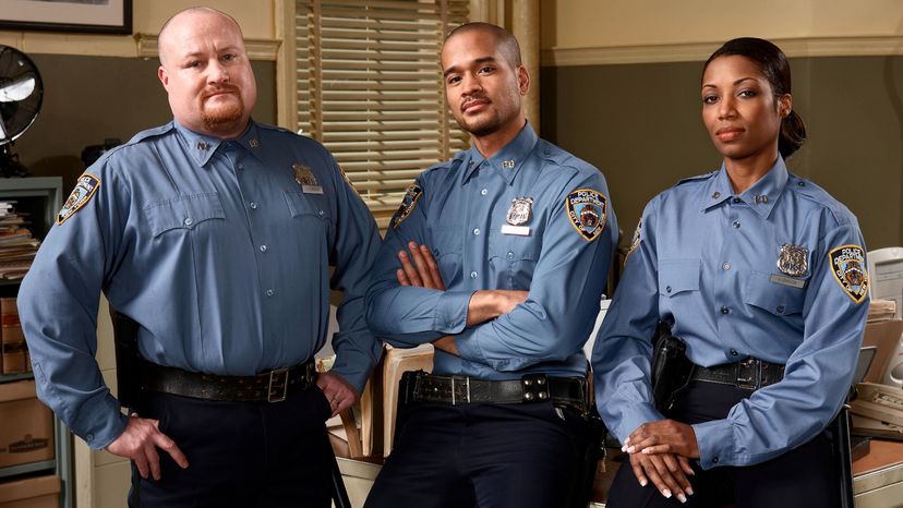 Police officers in an office.