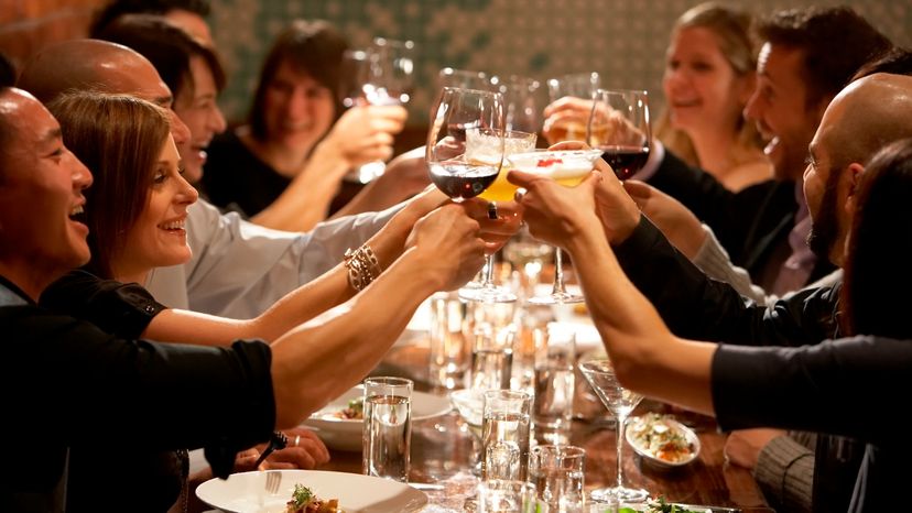 A group of friends having dinner in a restaurant. 