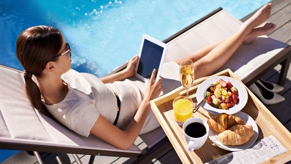 young woman relaxing by pool