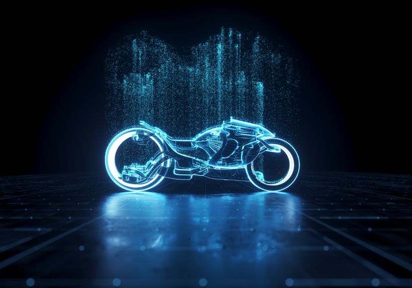 Digital generated image of generic futuristic glowing electric bike with illuminating particles over in on black background. Andriy Onufriyenko / Getty Images
