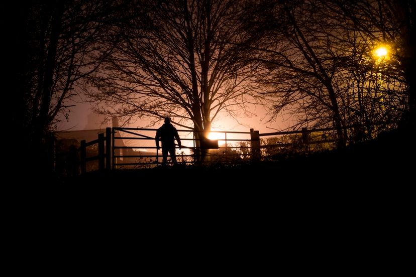 A mans silhouette stands out on a winters night in the UK Edward Crawford / Getty Images