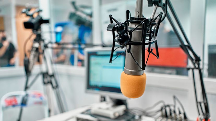 Close up photo of a radio station microphone in a recording studio. 