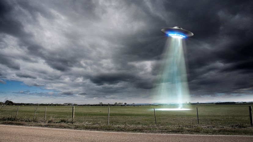 A UFO over an off country road. 
