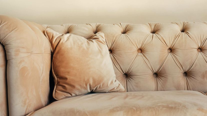 A beige suede sofa. 