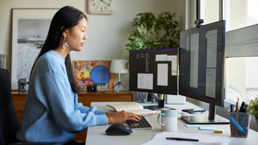 A woman working on her computer.