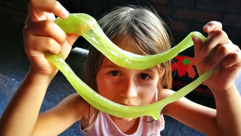 A child playing with play dough. 