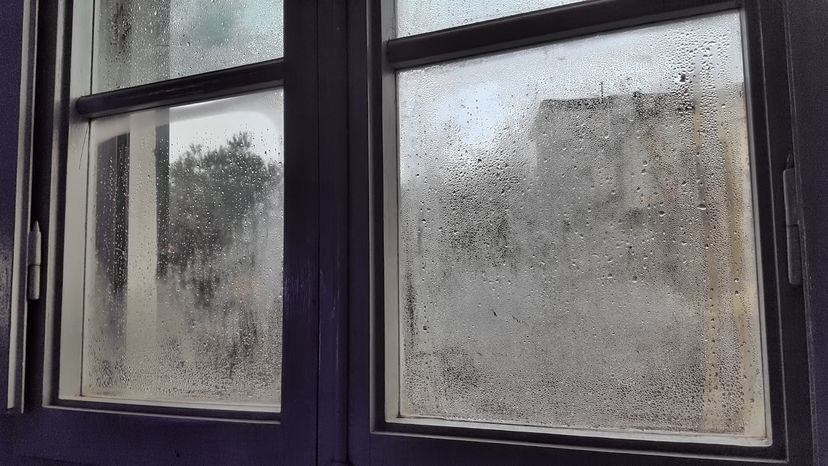 A glass window with rain drops on it. 