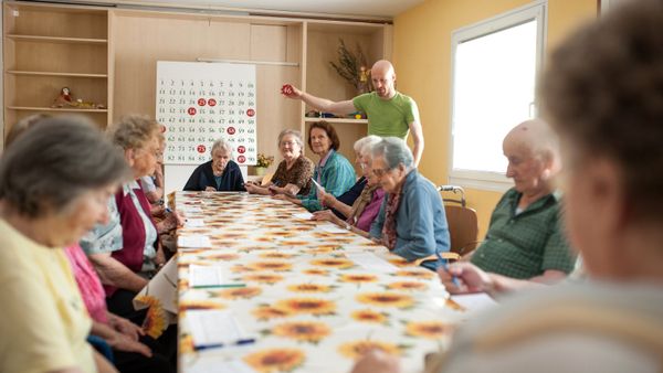 Seniors in a retirement community playing bingo. 