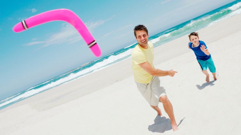 Aman throwing a boomerang at the beach 