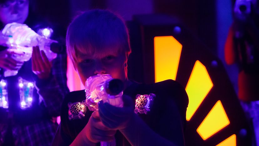 A teenager playing laser tag.