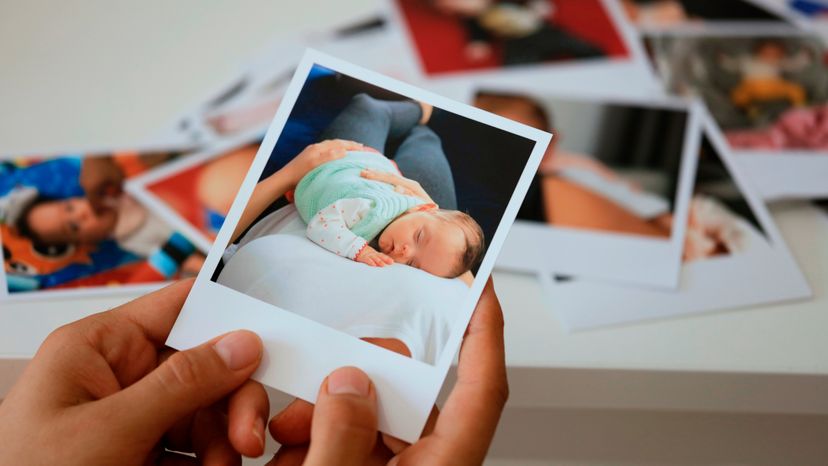 A hand holding an instant photo 