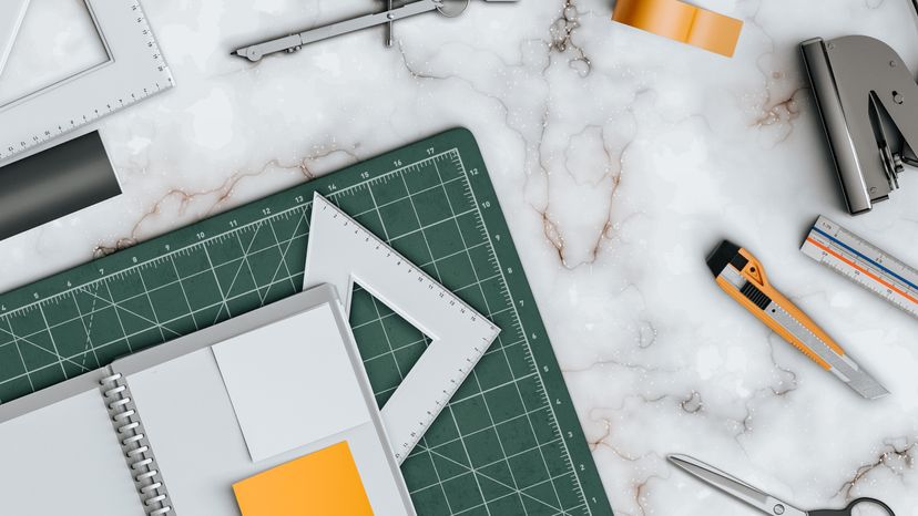 Drawing instruments scattered on a table. 