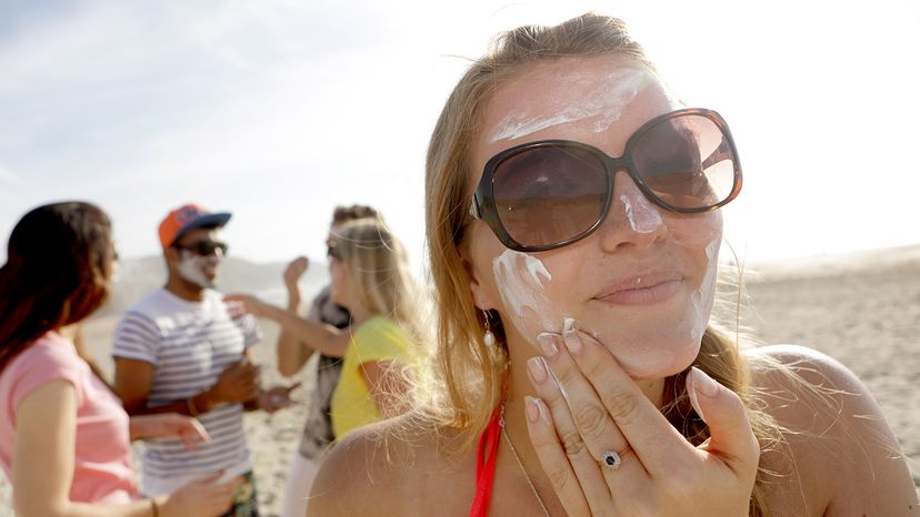 Person applying sunscreen