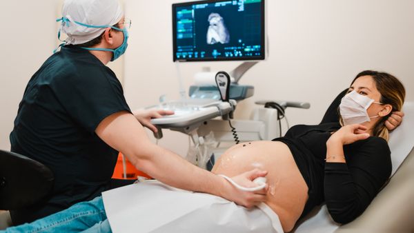 A pregnant woman getting an ultrasound. 