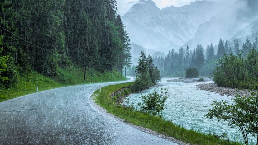 Heavy rain falling on a mountain road. 