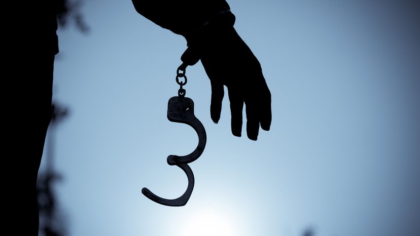 A man breaking out of a handcuff. 