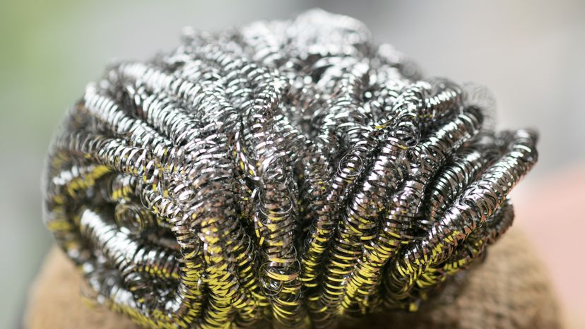 A closeup image of a steel wool/metal sponge. 