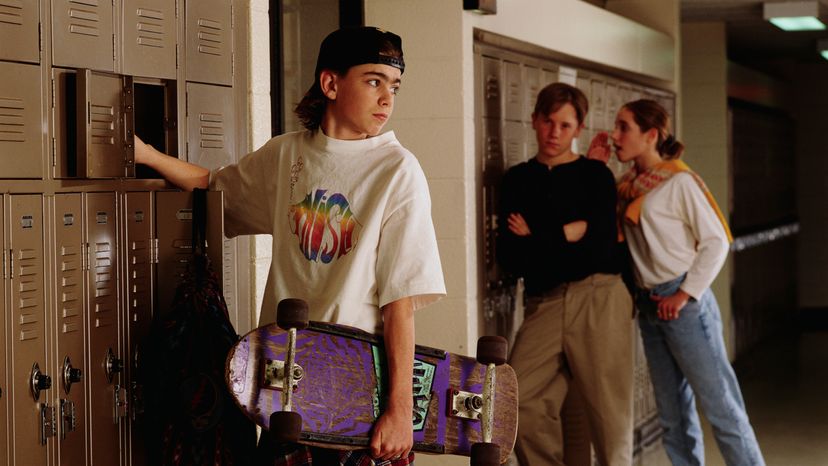 A boy at his locker in schools during the 90s