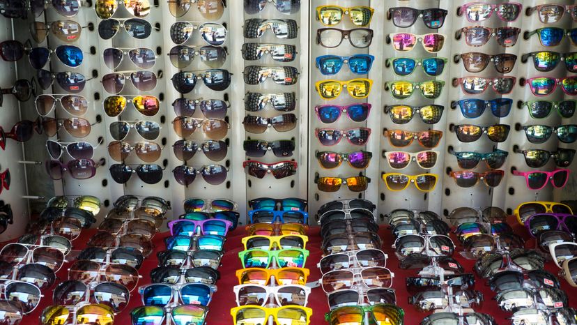 Different sunglasses displayed on a table.