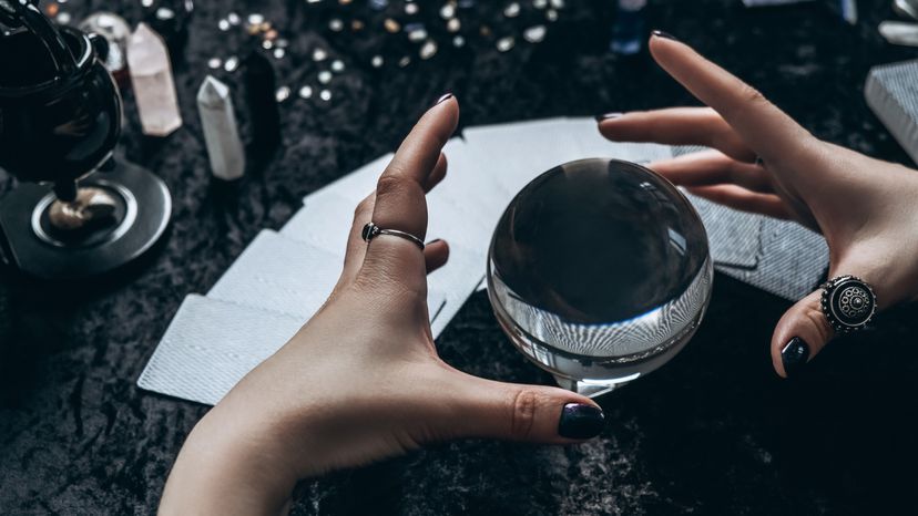 A woman's hand conjuring on a sphere. 