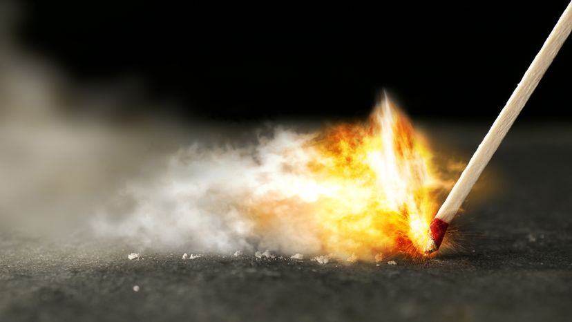 A frame of a wooden kitchen match striking on a surface. 