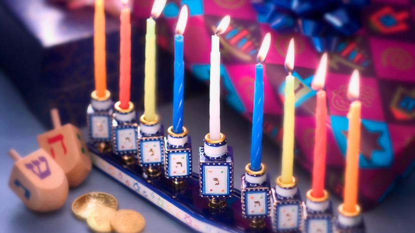 A row of nine candles lit for Hanukkah.  