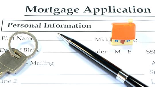 Who buys up mortgages on the secondary market?