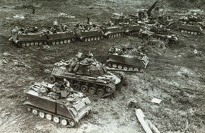 M-48A2s and armored personnel carriers of the 11th Armored Cavalry Regiment prepare for a sweep through Cambodia in 1970.