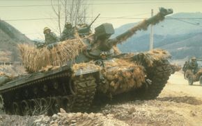 An M-48A5 Patton guards a convoy during Team Spirit Exercises in South Korea during 1984.