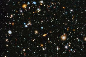 This parallel field observation from the NASA/ESA Hubble space telescope reveals thousands of colorful galaxies swimming in the inky blackness of space. Given the universe's scale, who's to say there isn't a parallel reality?