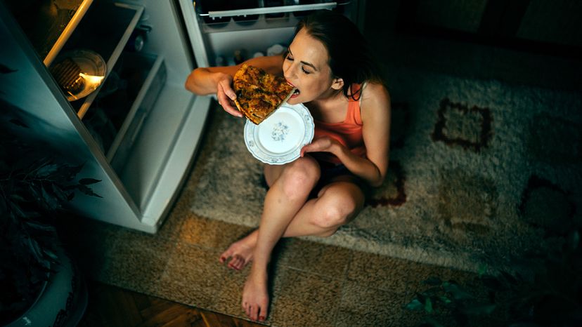 girl eating pizza