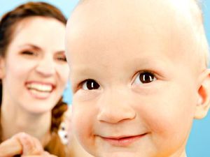 baby and mother smiling