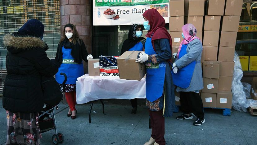 Muslim women handing out food