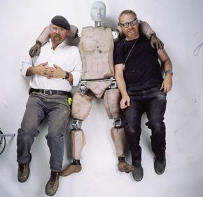 Jamie and Adam get cozy with "Buster" the crash test dummy.”border=